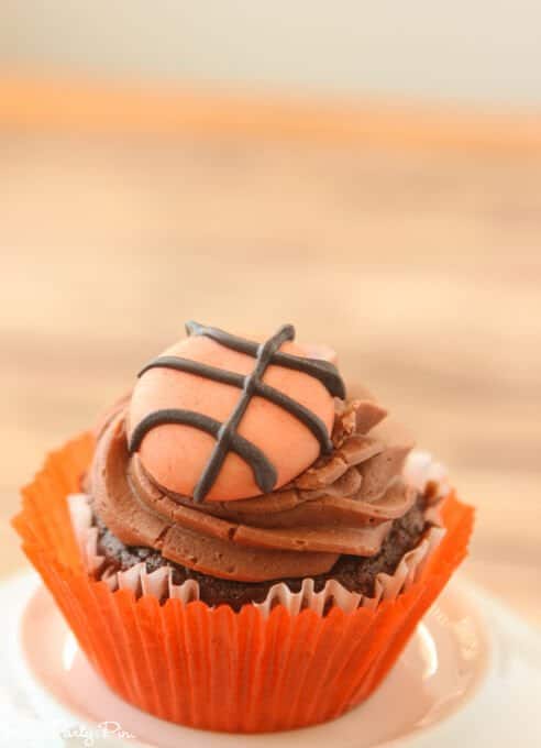 Chocolate Coke cupcakes with a chocolate buttercream and fondant basketballs on topChocolate Coke cupcakes with a chocolate buttercream and fondant basketballs on top