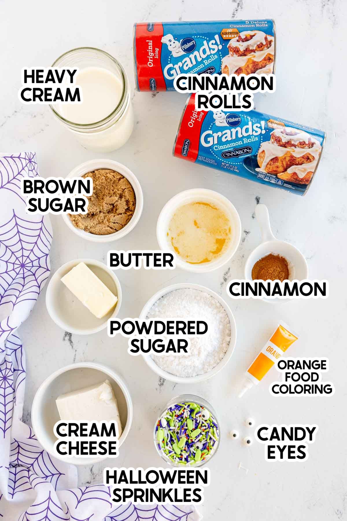 ingredients to make Halloween cinnamon rolls with labels