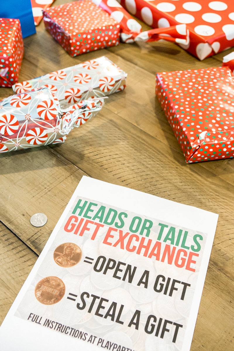 Playing sheet for a heads or tails gift exchange game