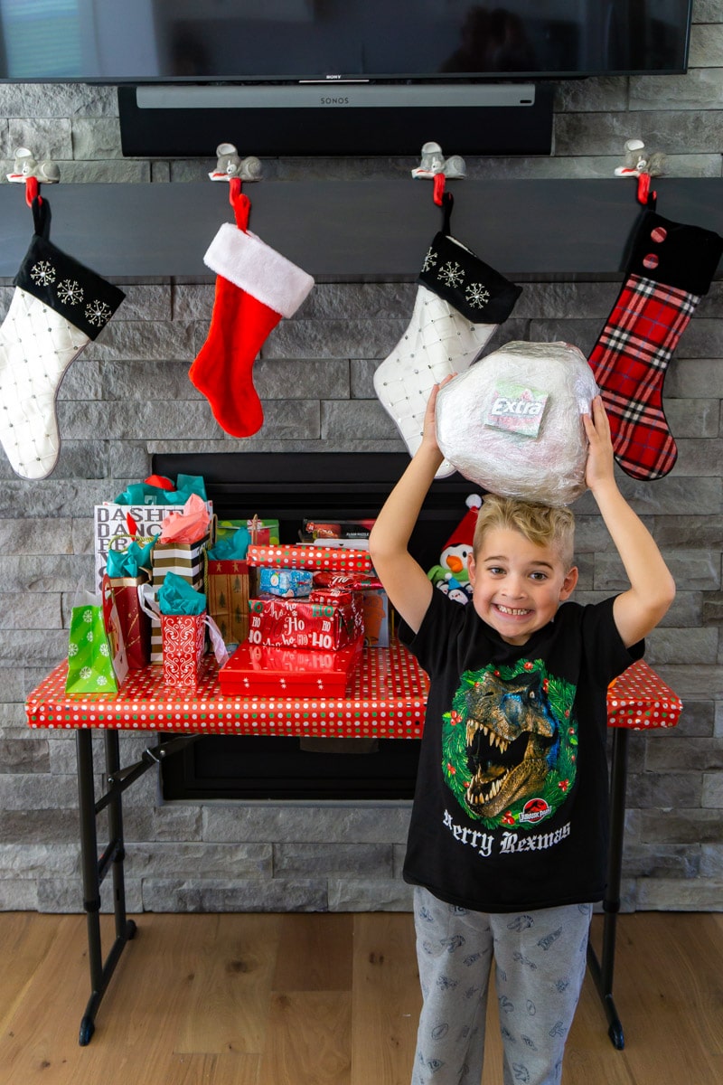 Older kids have smaller Christmases (few, bigger ticket items). A few years  ago I started hitting the dollar store and buying 20 to 30 random dollar  items and wrapping them. Now the