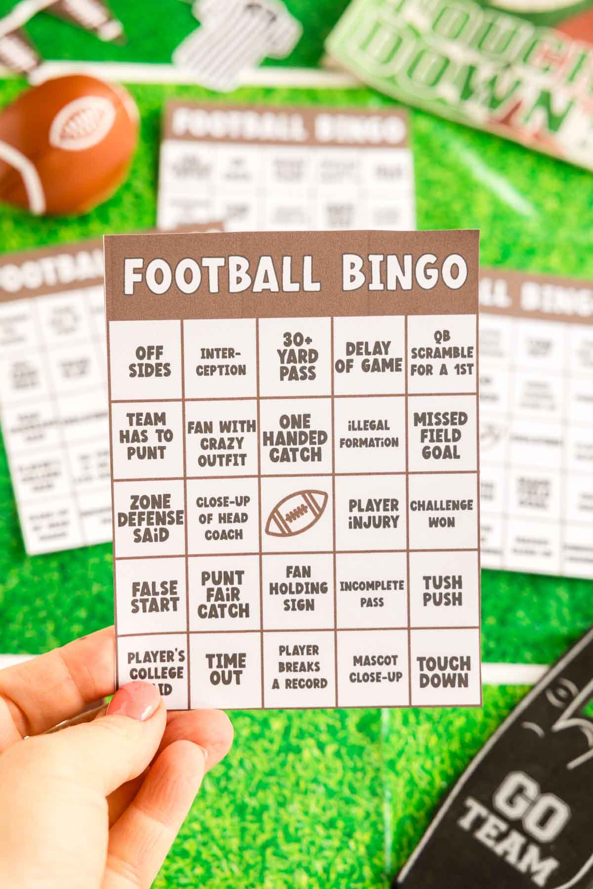 hand holding a Super Bowl bingo card