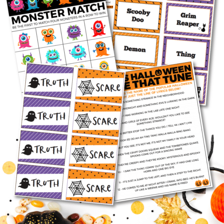 Printed out Halloween games in a pile on a white background