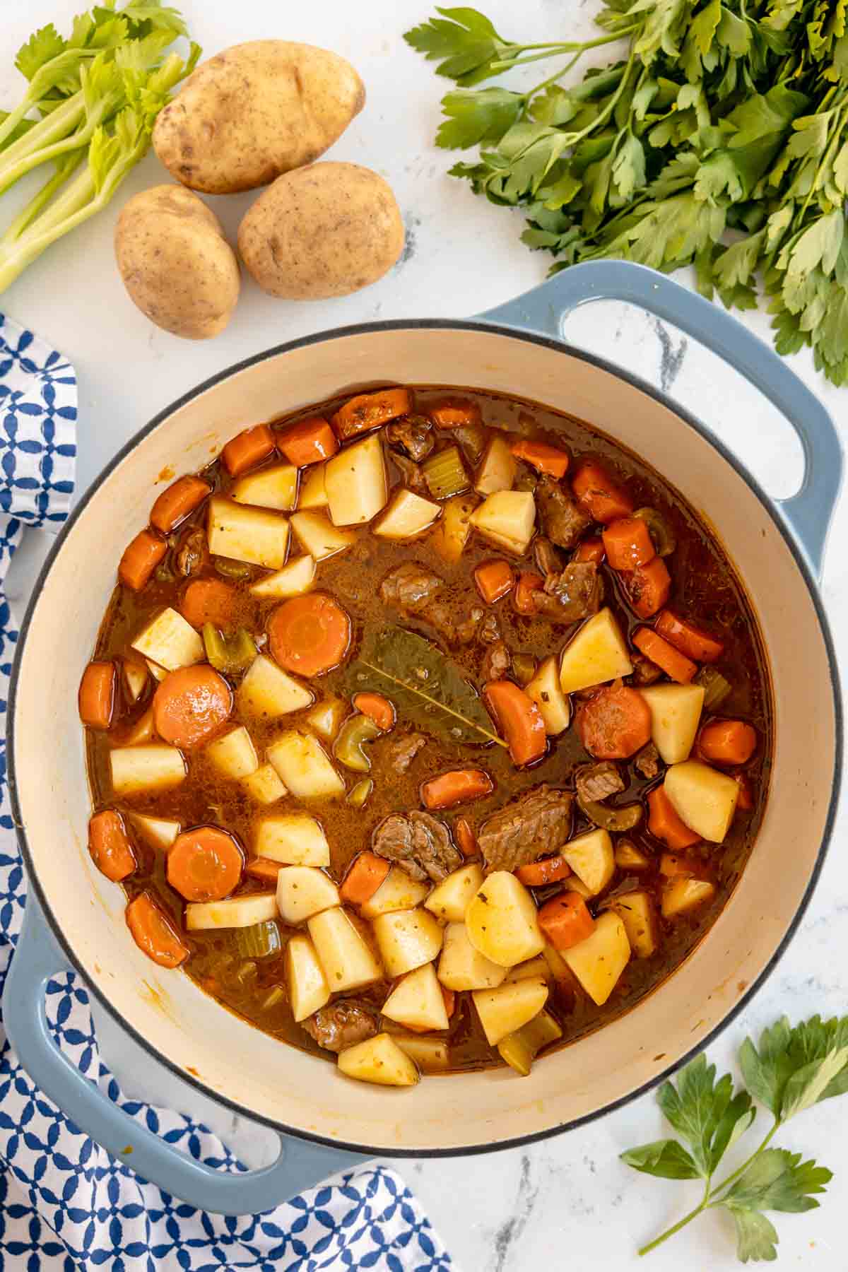 stock pot with beef stew with potatoes just added 