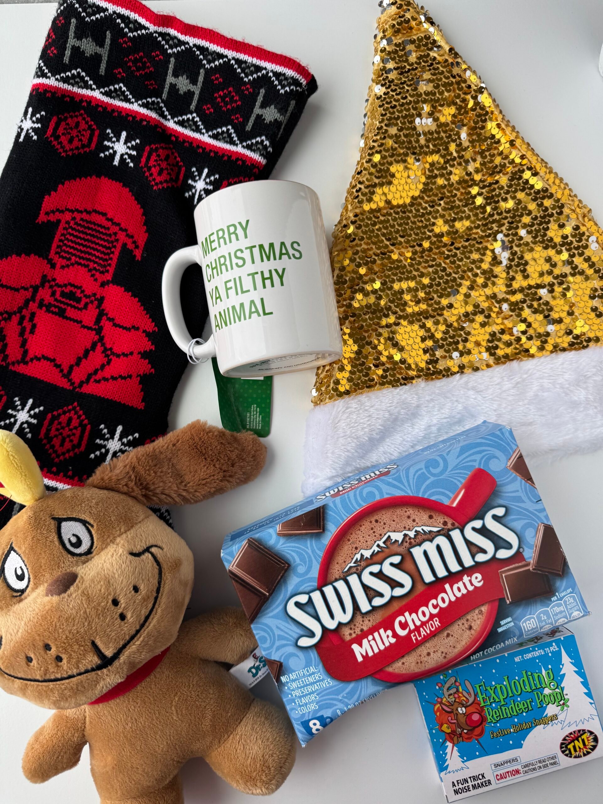 a bunch of Christmas items laying on a white background