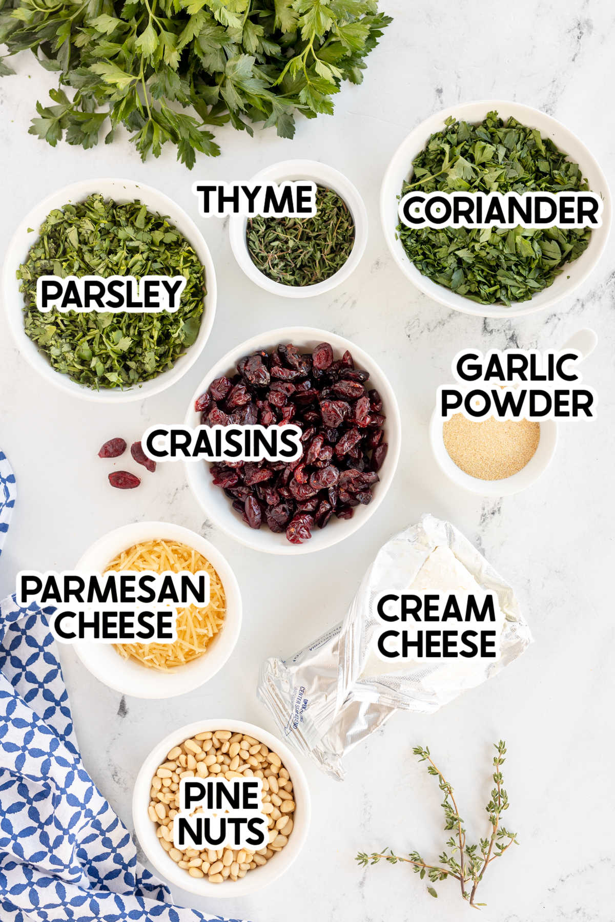 ingredients to make a Christmas tree cheese ball with labels