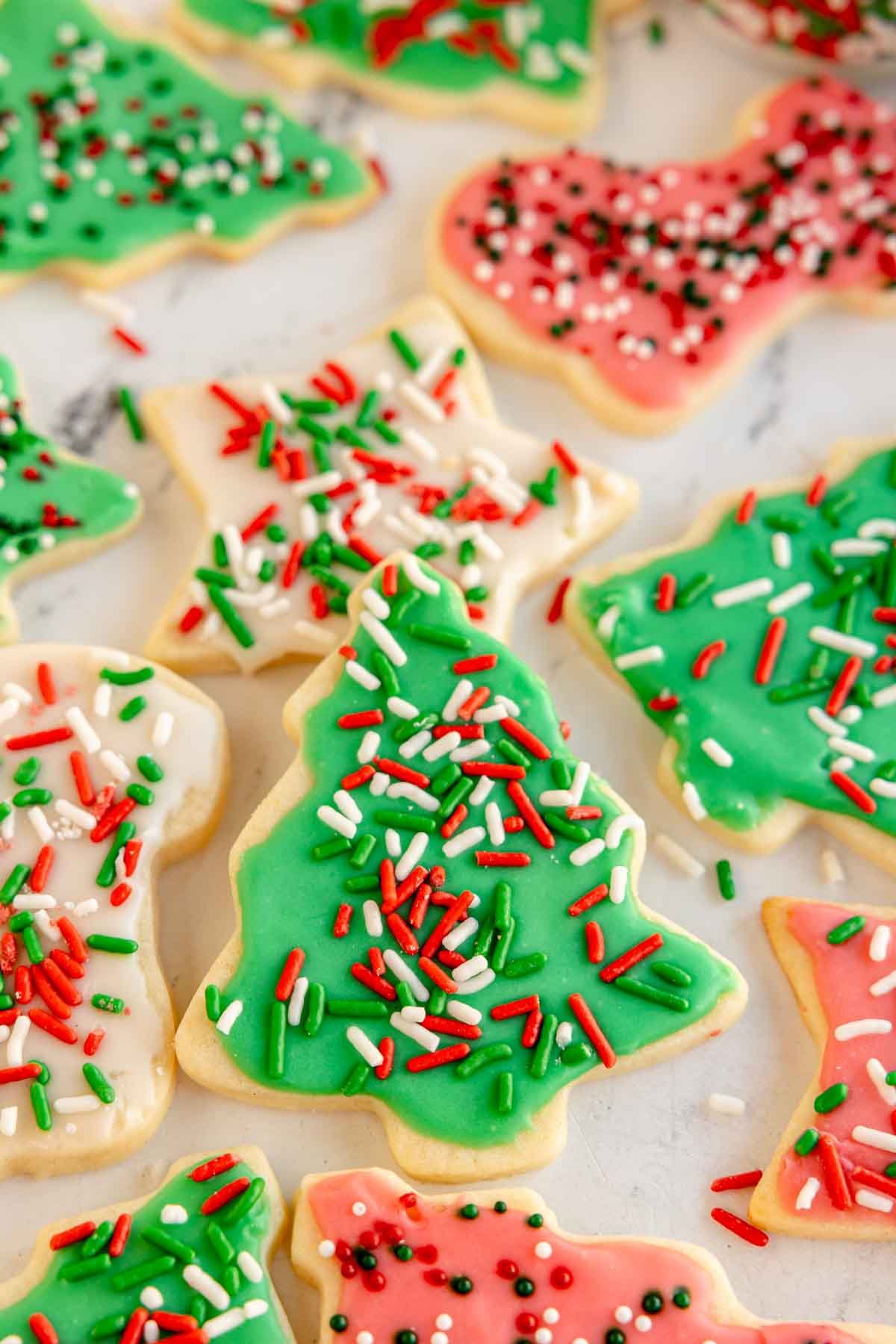 Christmas tree sugar cookies with green frosting and sprinkles