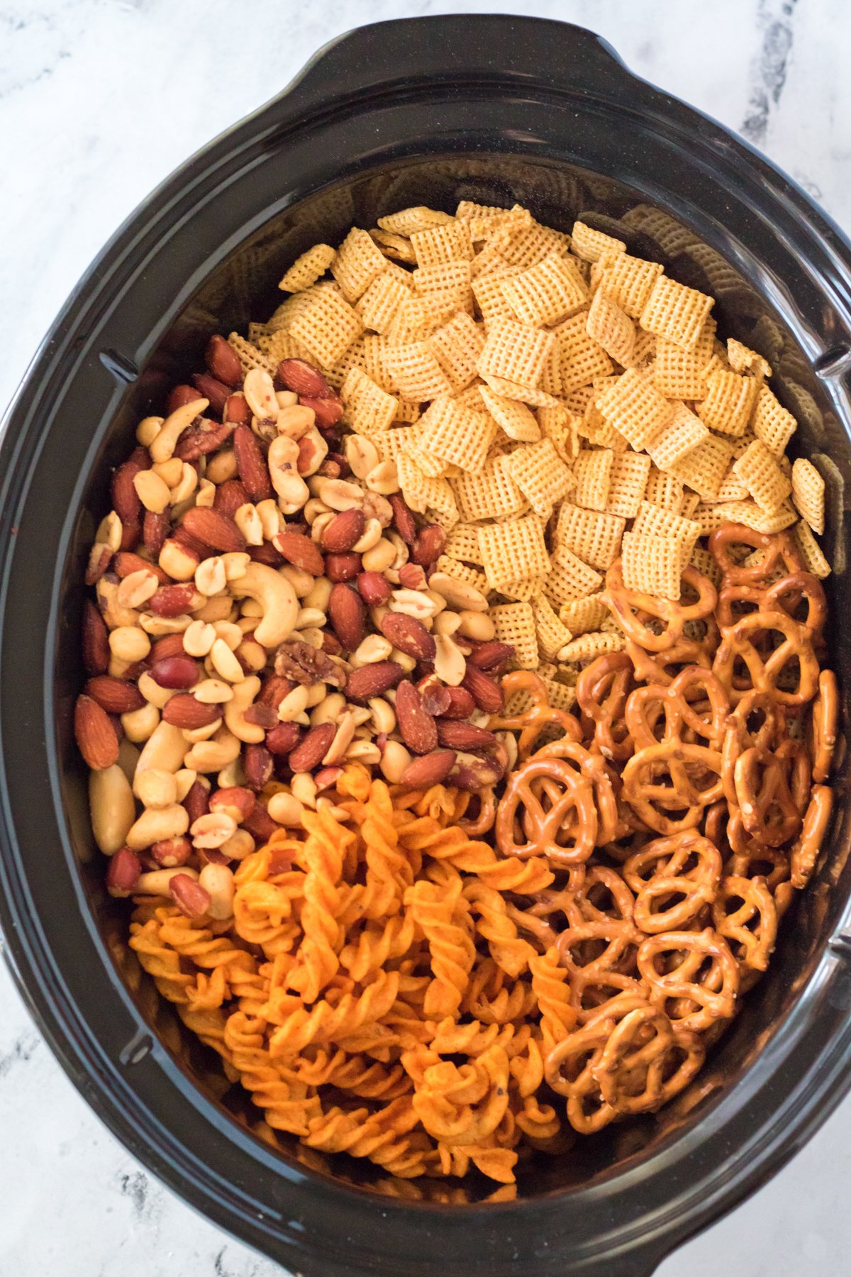 ingredients for ranch chex mix in a slow cooker