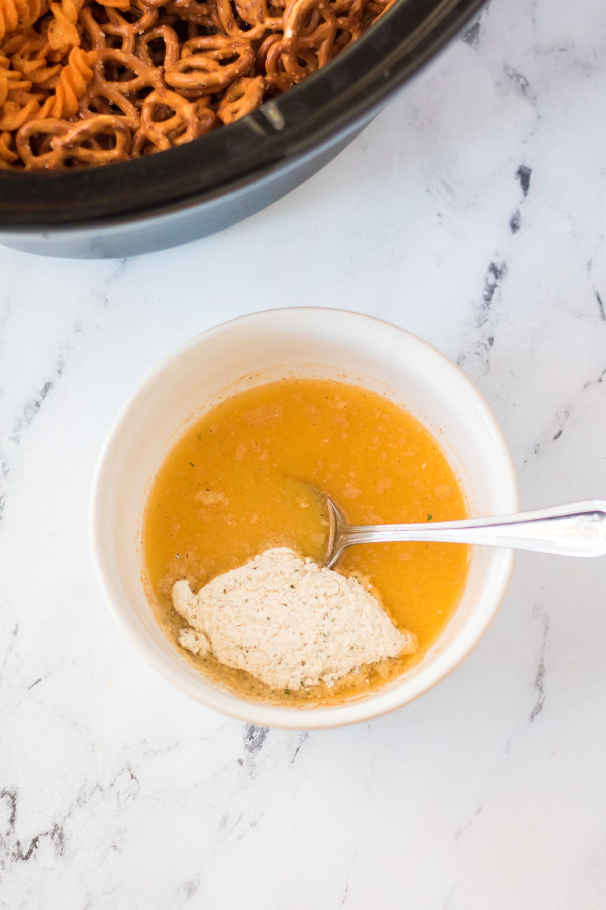 bowl with melted butter and seasonings