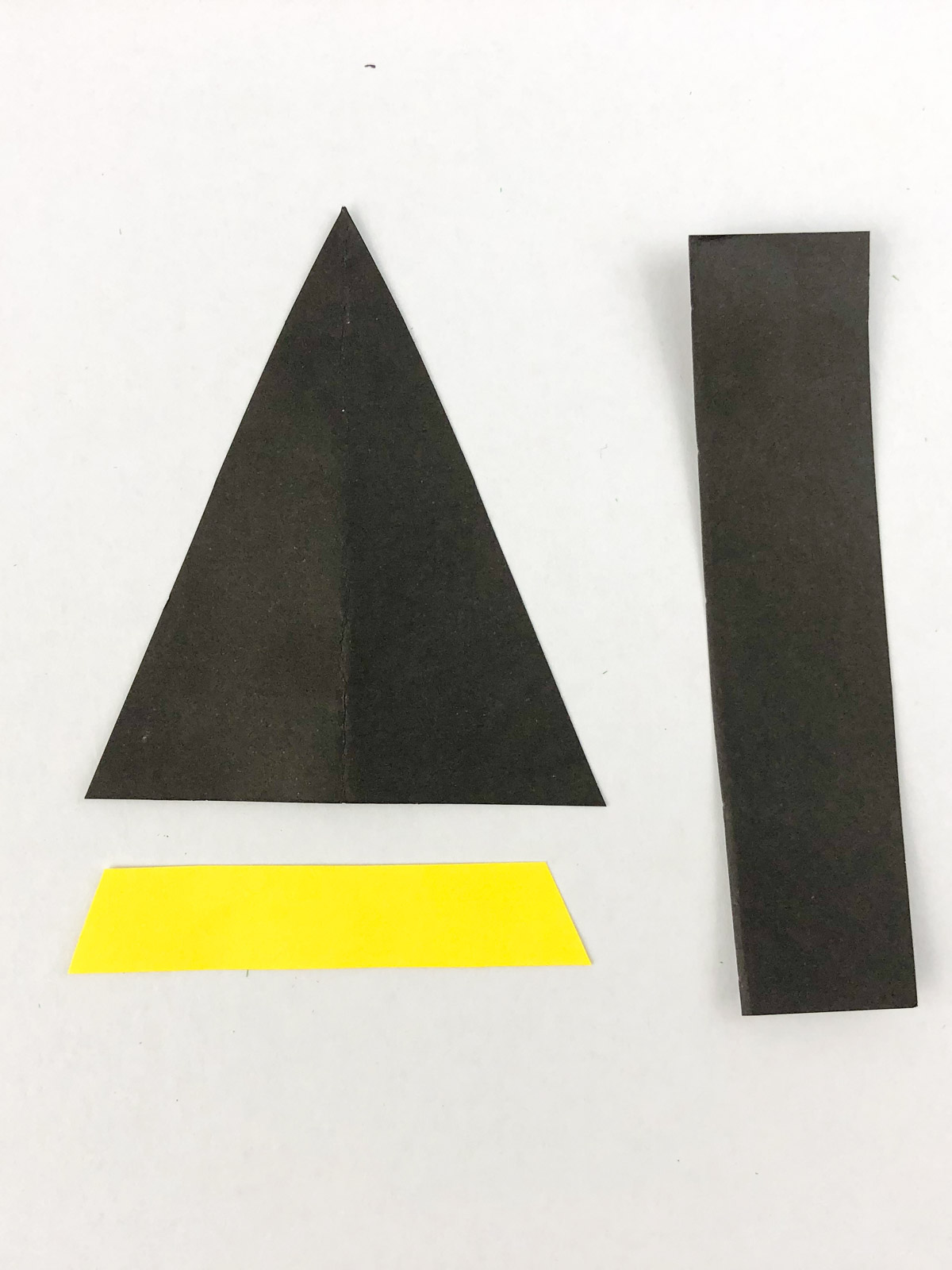 black and yellow paper cut into strips