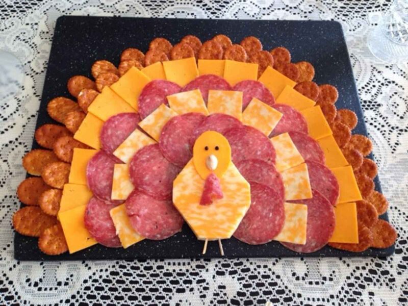 cheese and meat tray arranged in shape of a turkey