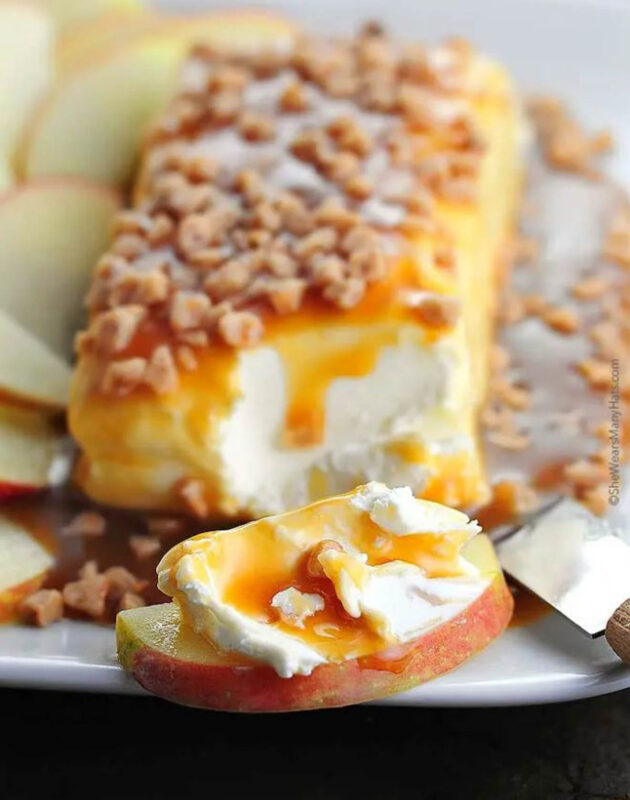 cream cheese block topped with caramel and nuts