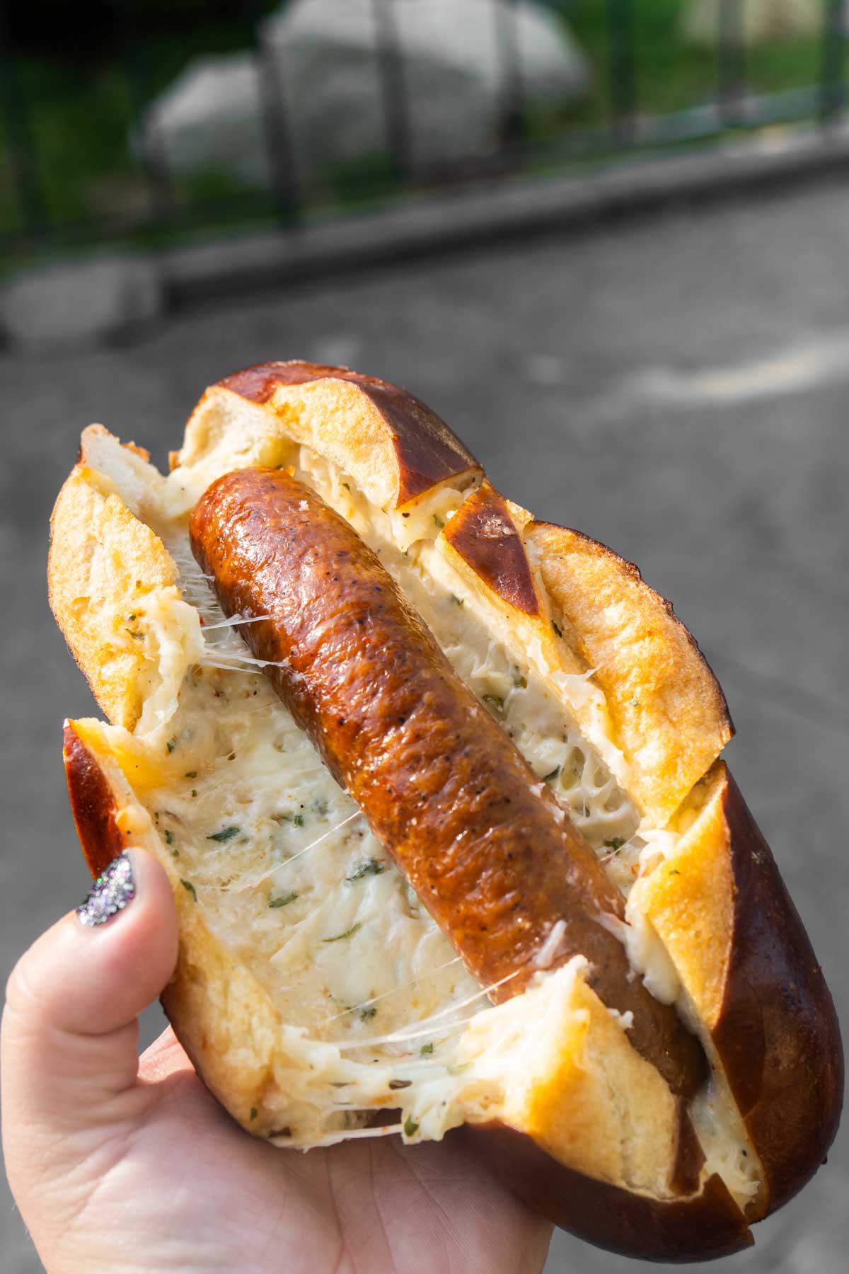 garlic cheesy pretzel bread with a brat in the middle