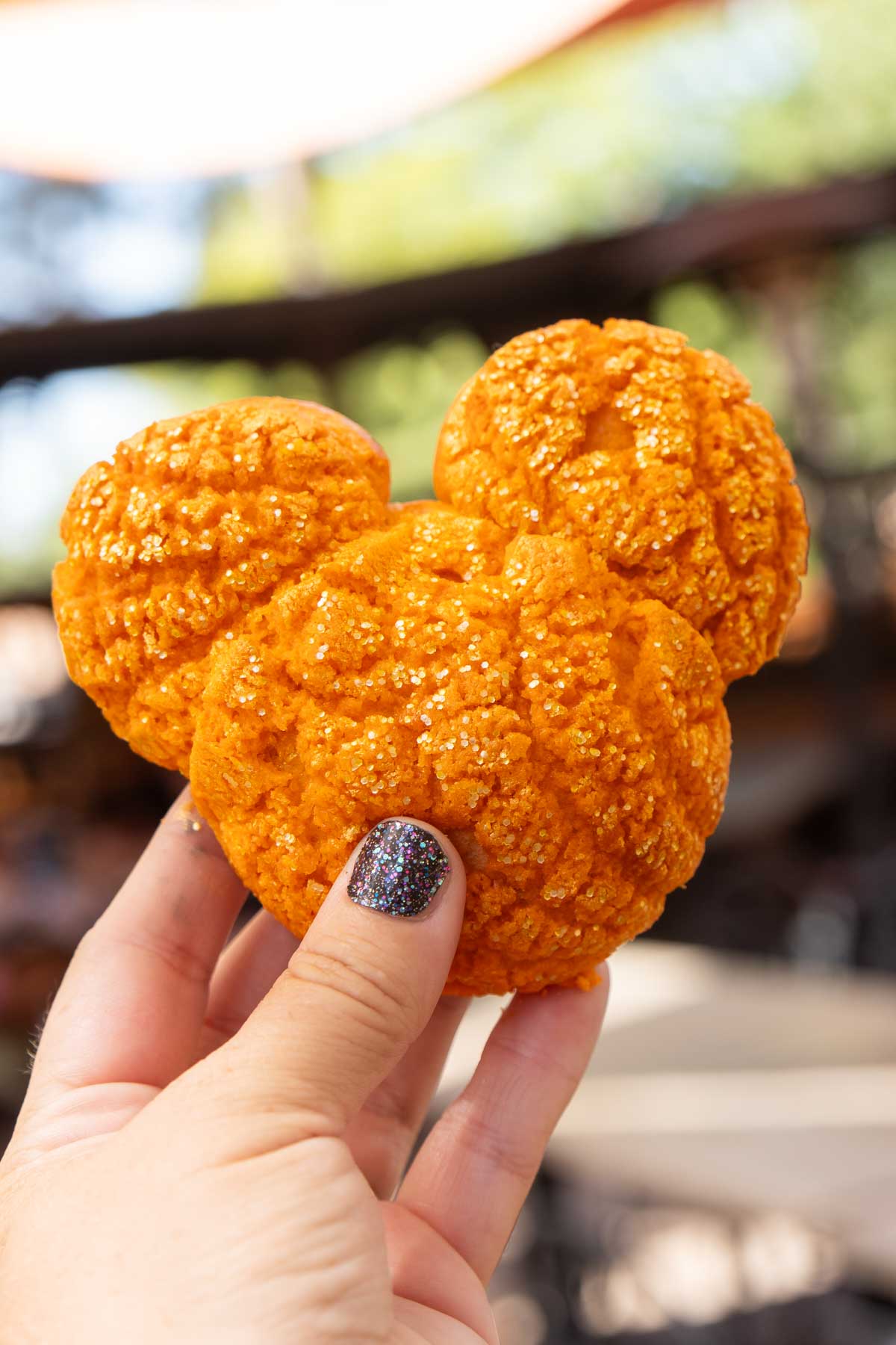 hand holding a Mickey cream puff at Disneyland