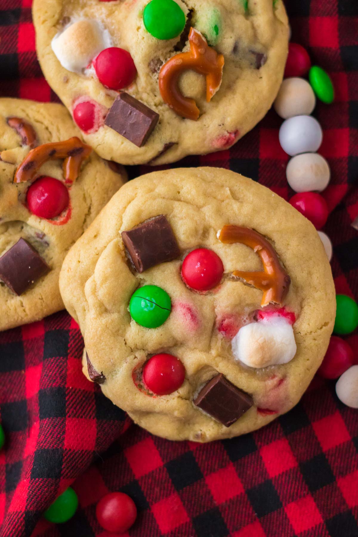 three Christmas kitchen sink cookies on buffalo plaid fabric