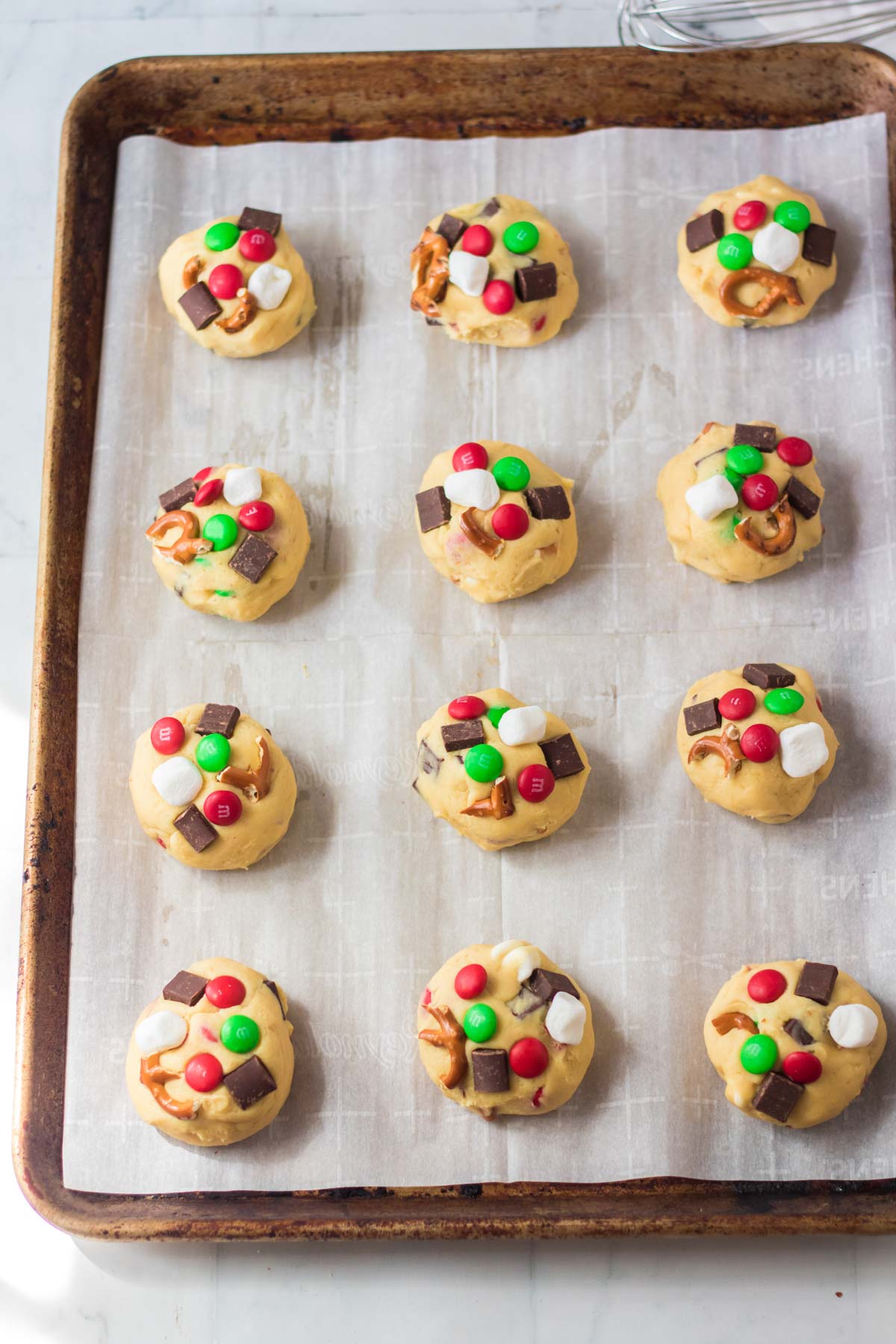 unbaked Christmas kitchen sink cookies on a baking sheet