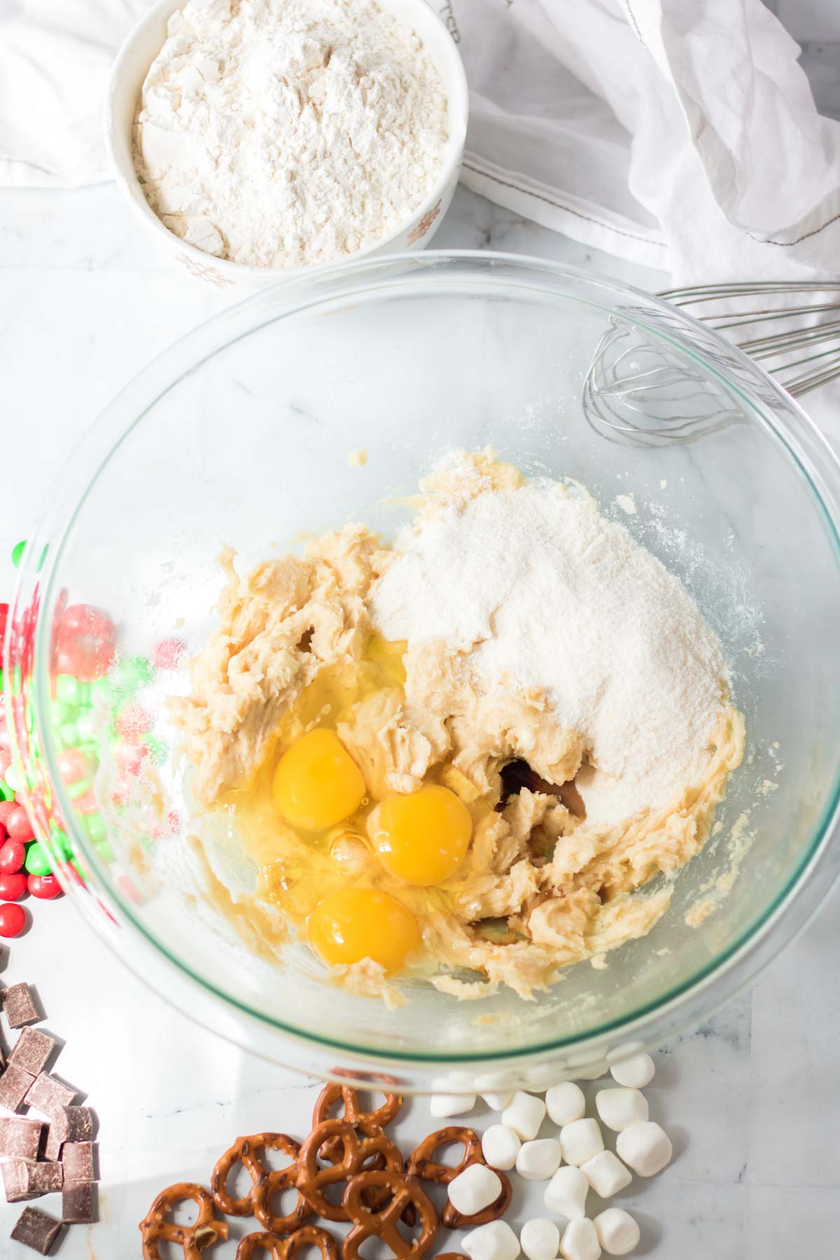 glass bowl with ingredients to make kitchen sink cookies