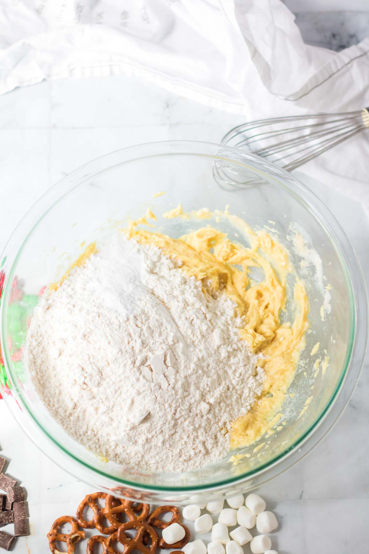 glass bowl with flour and cookie dough