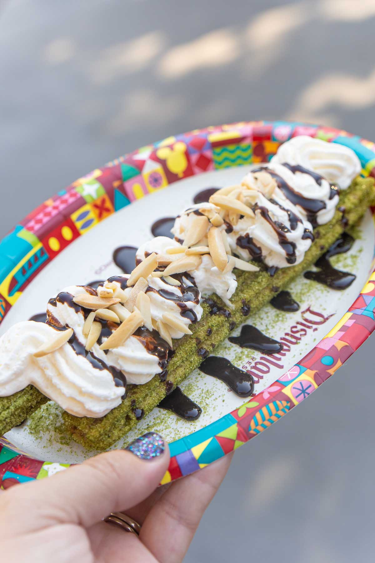 green churro on a plate at Disneyland