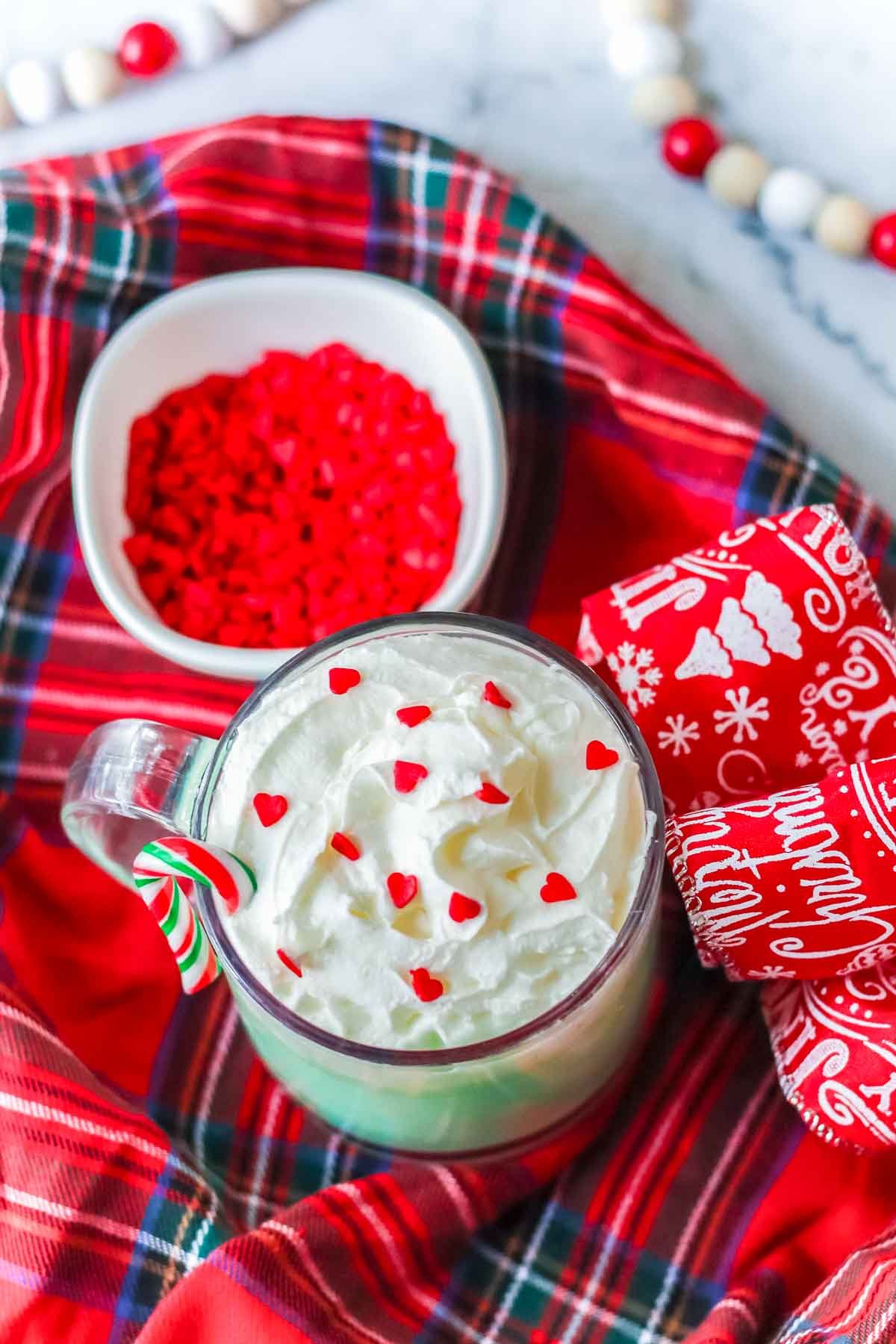 glass of hot chocolate with whipped cream and sprinkles