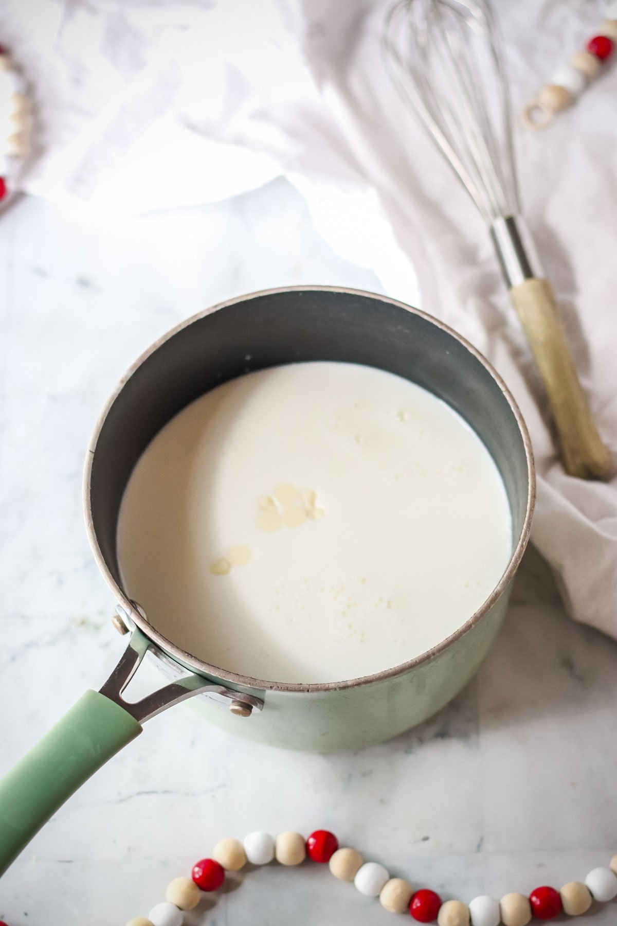 white chocolate chips and milk in a pan