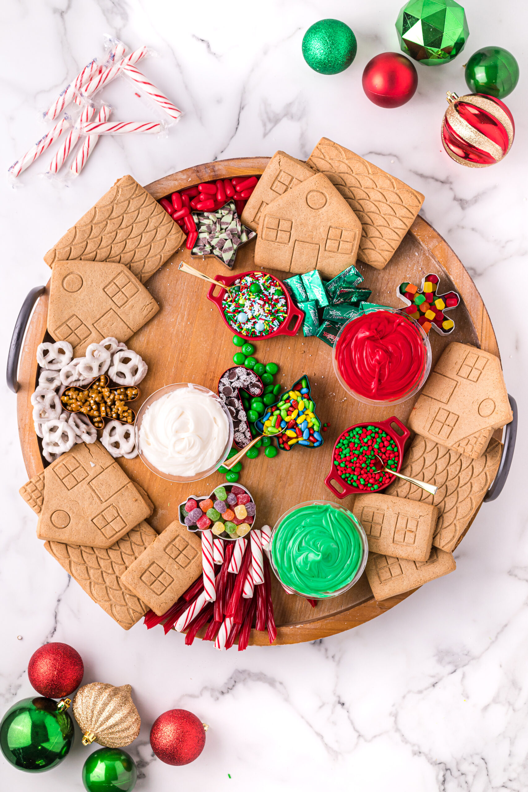 gingerbread house charcuterie board with just gingerbread and frosting