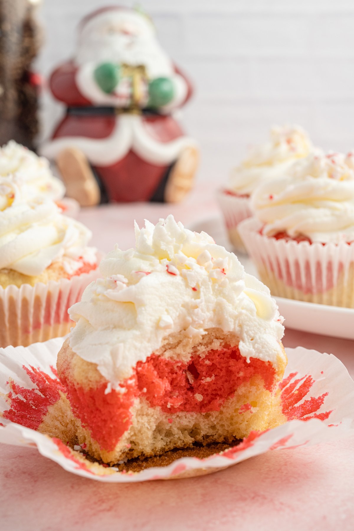 half eaten candy cane cupcake in a wrapper