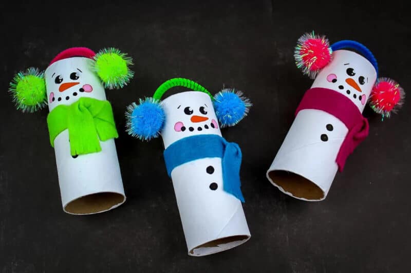 White paper rolls with snowman features and accessories