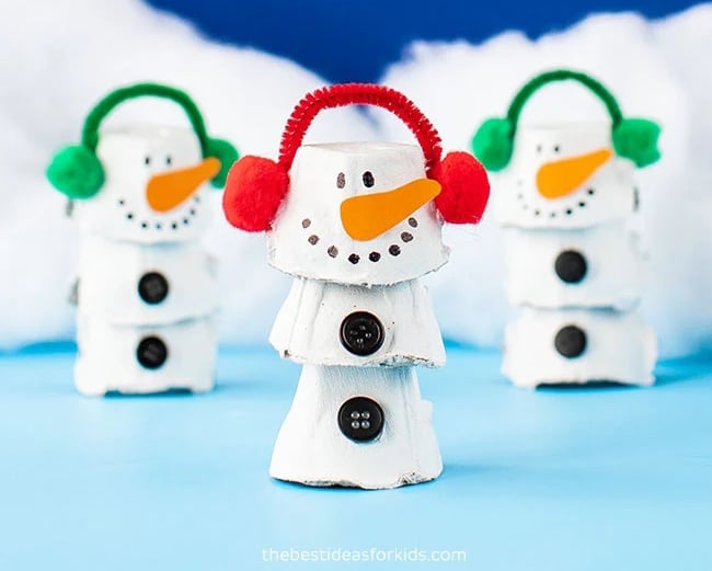 cut up egg carton with snowman features and ear muffs