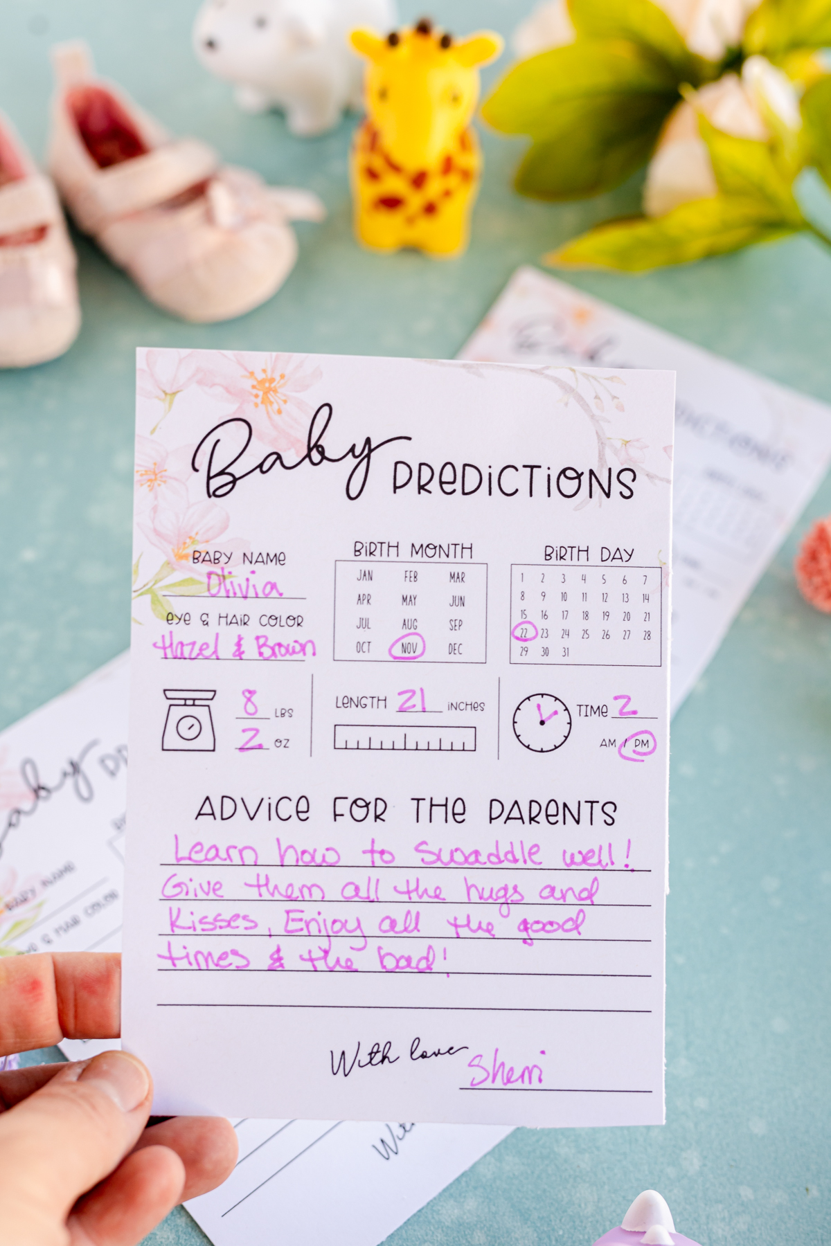 baby predictions cards filled out with info