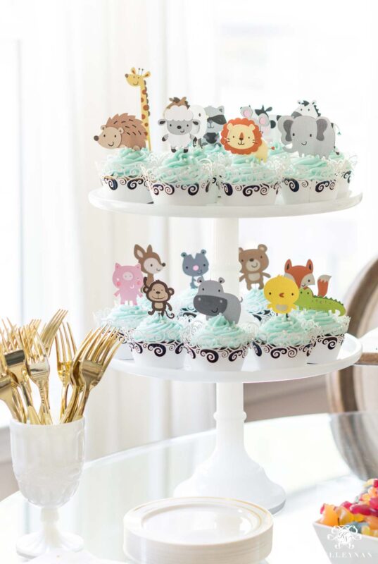 light blue cupcakes with animal toppers