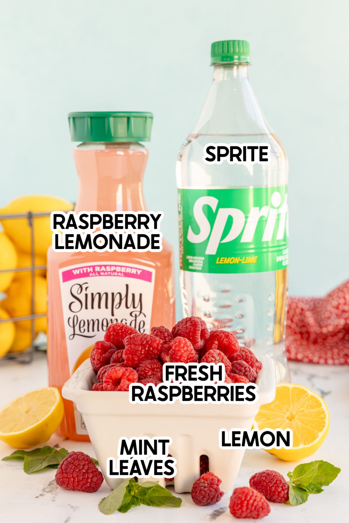 ingredients in a raspberry mocktail with labels