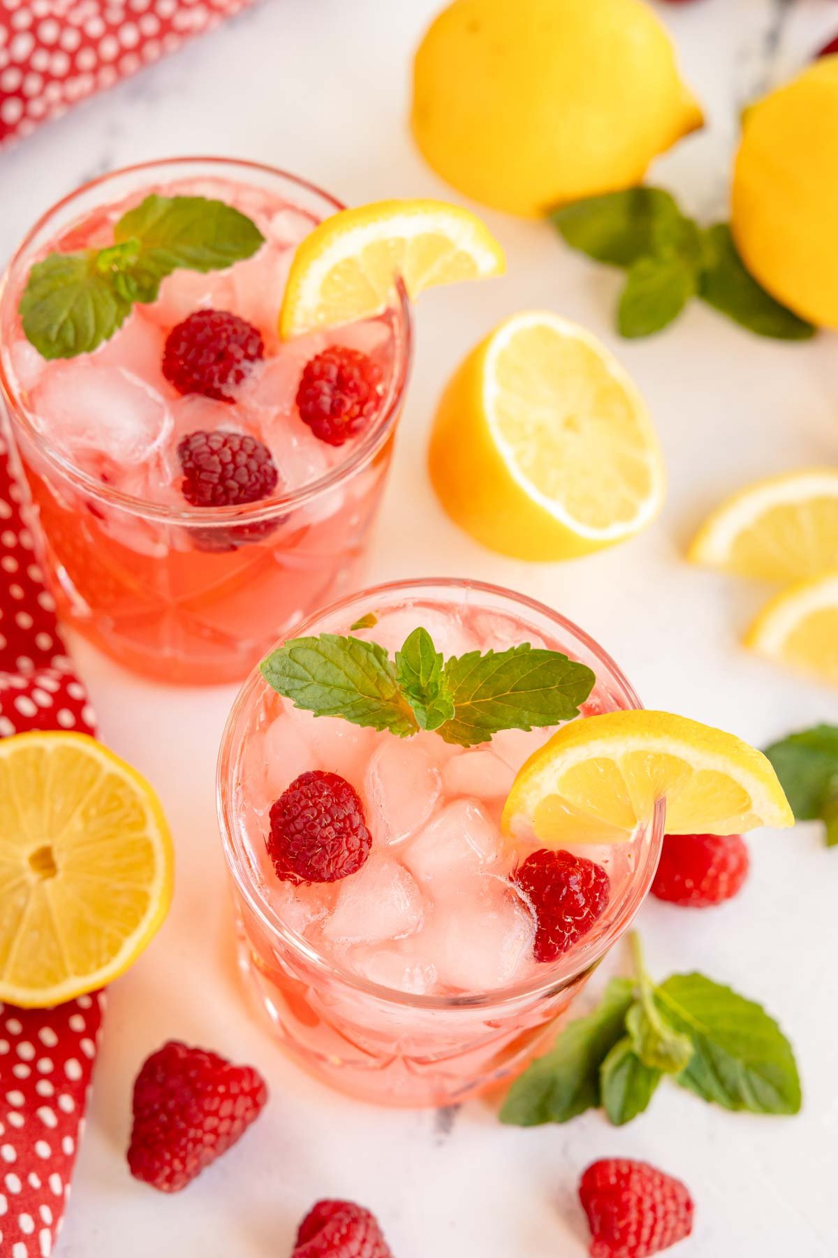 top down view of two raspberry mocktails 