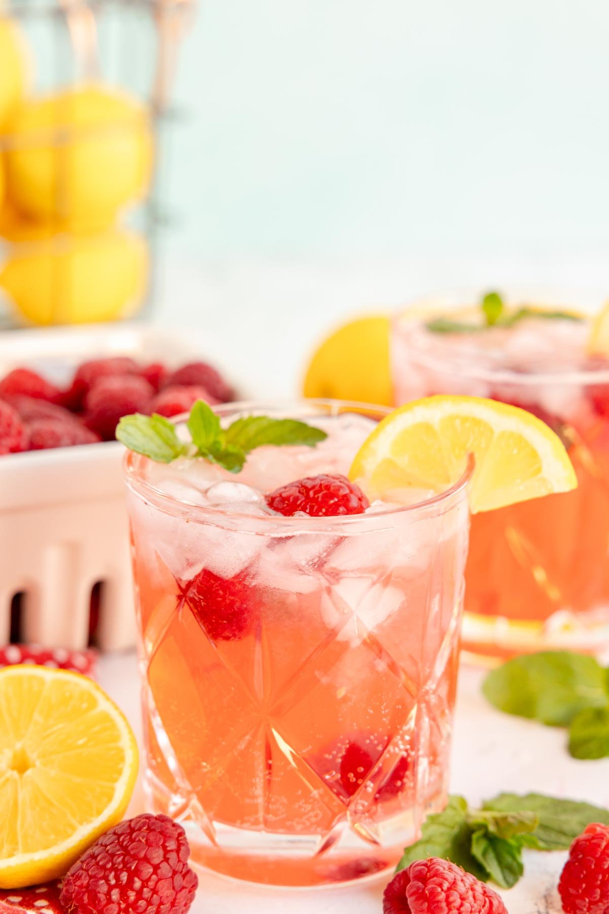 glass filled with a raspberry lemonade mocktail