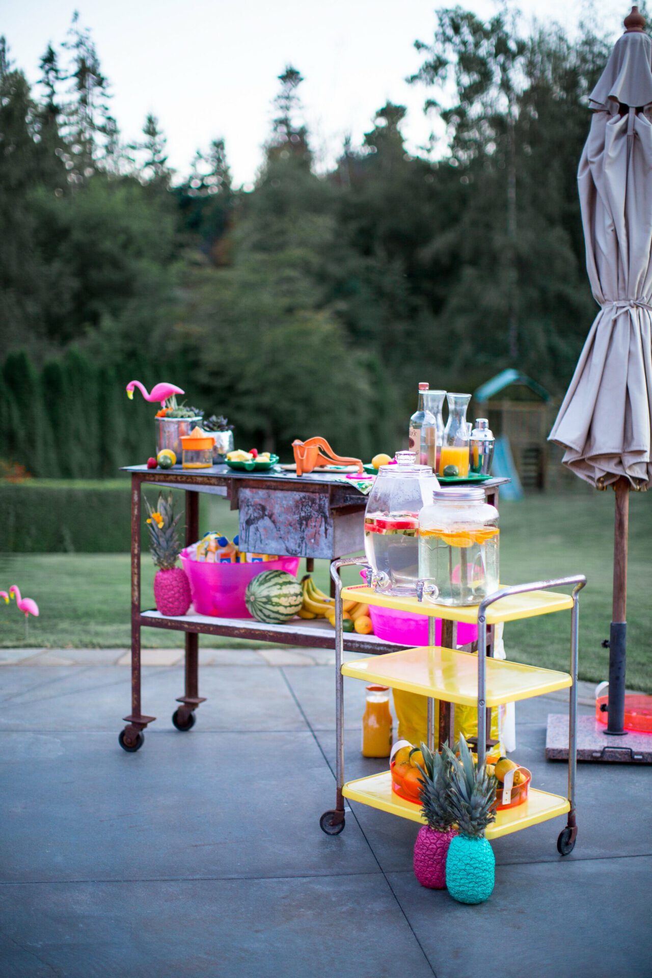 bar cart with colorful drinks on it