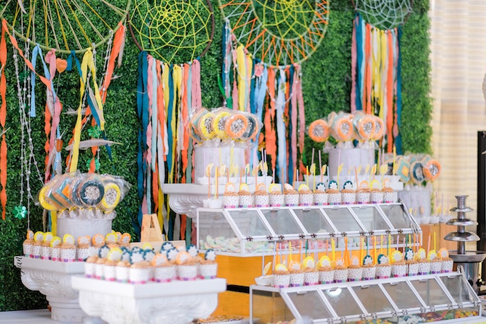 table with cupcakes and dream catchers
