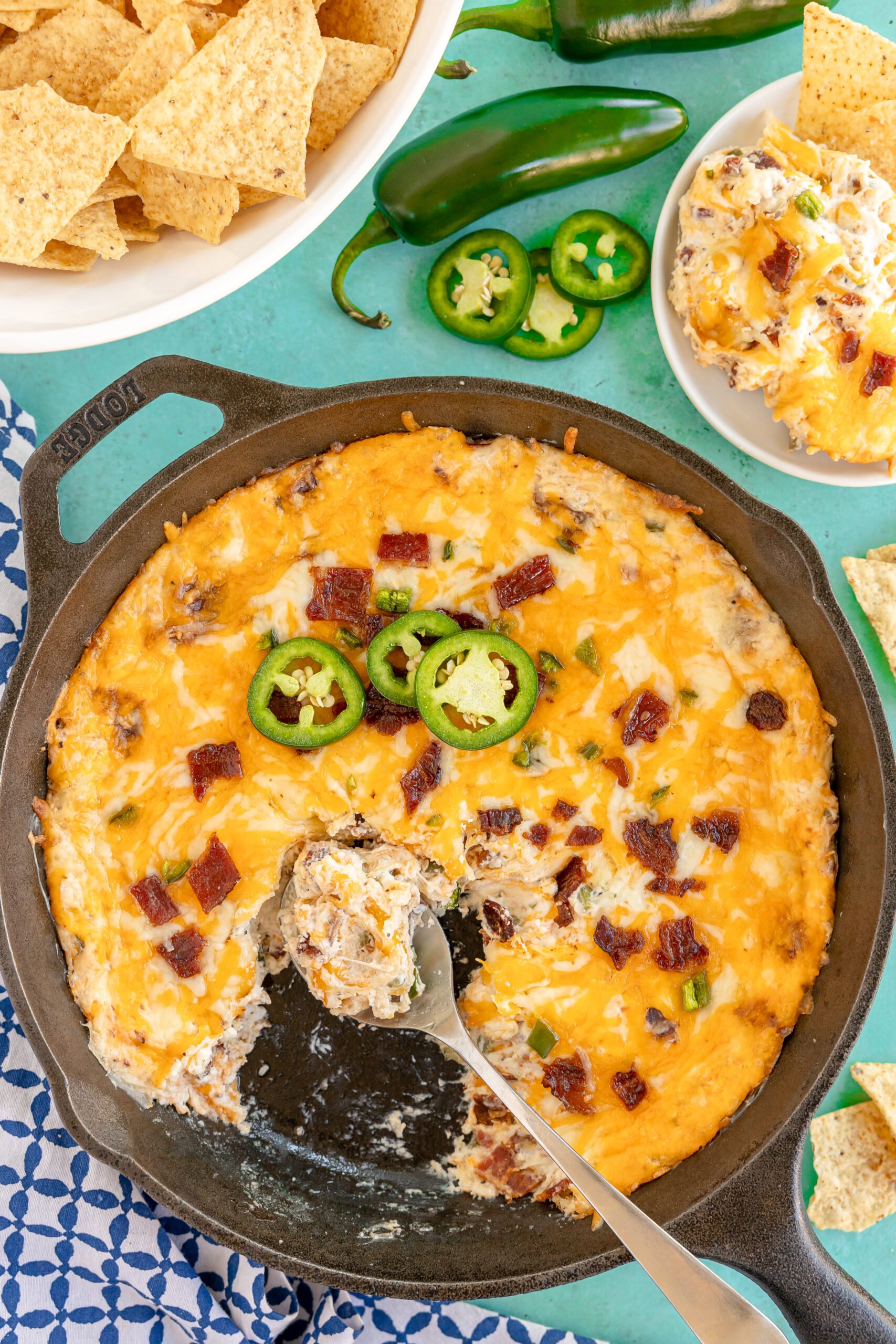 jalapeno popper dip with a spoon in it