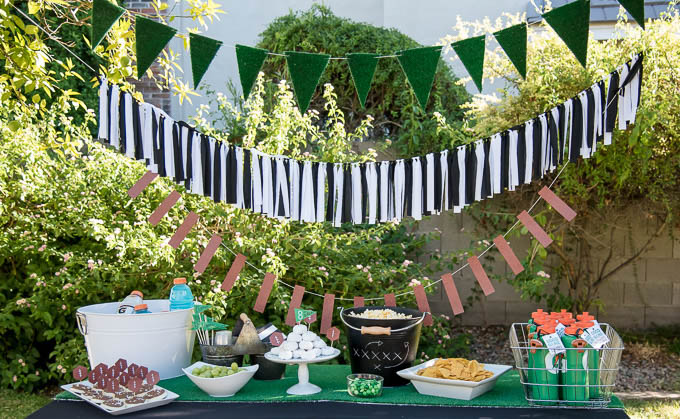 football tablescape with various sports garlands and foods
