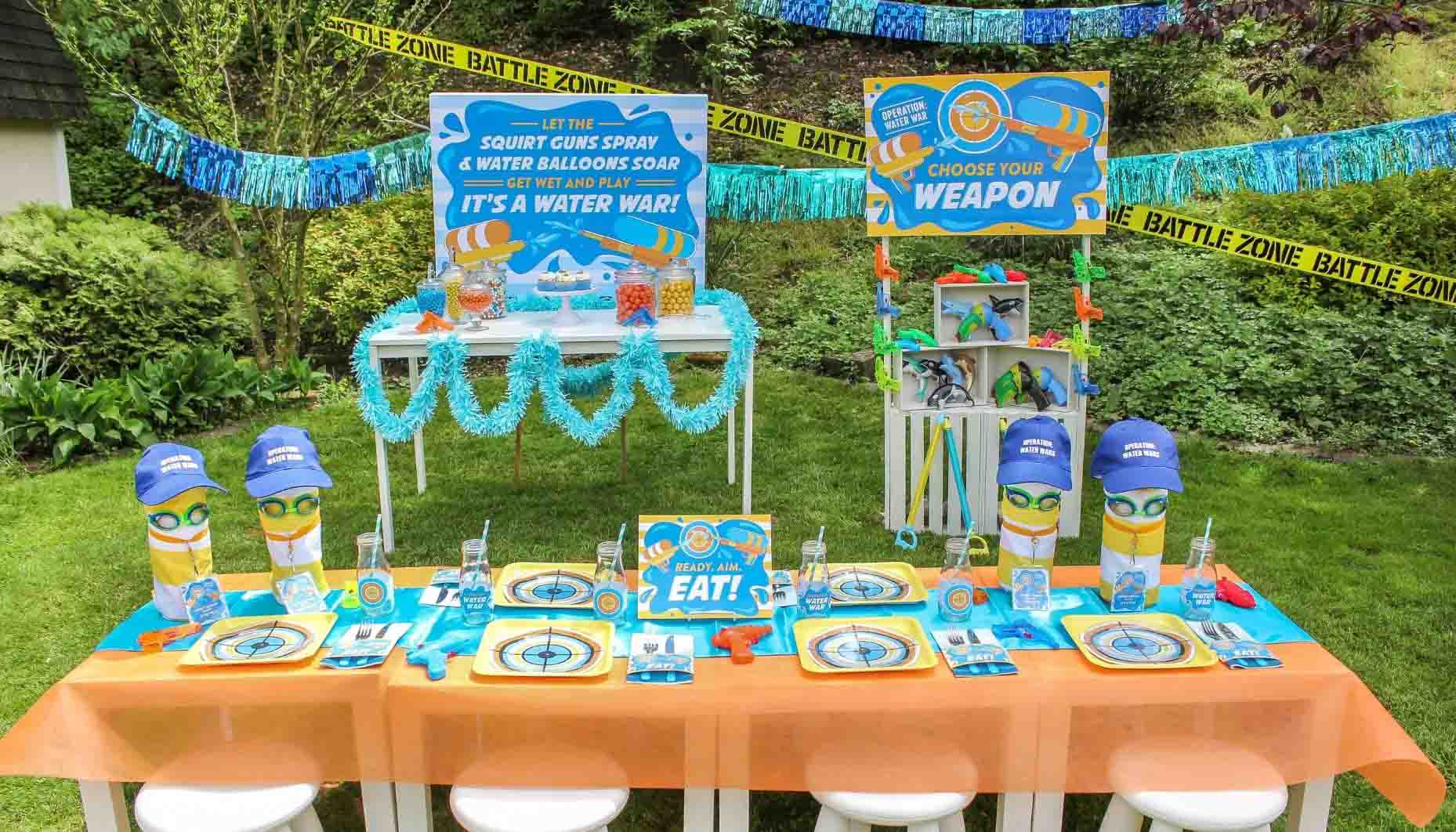 water wars party table with lots of water guns