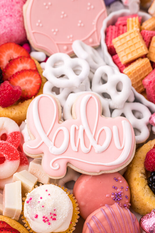 baby shower sugar cookie on a baby shower charcuterie board