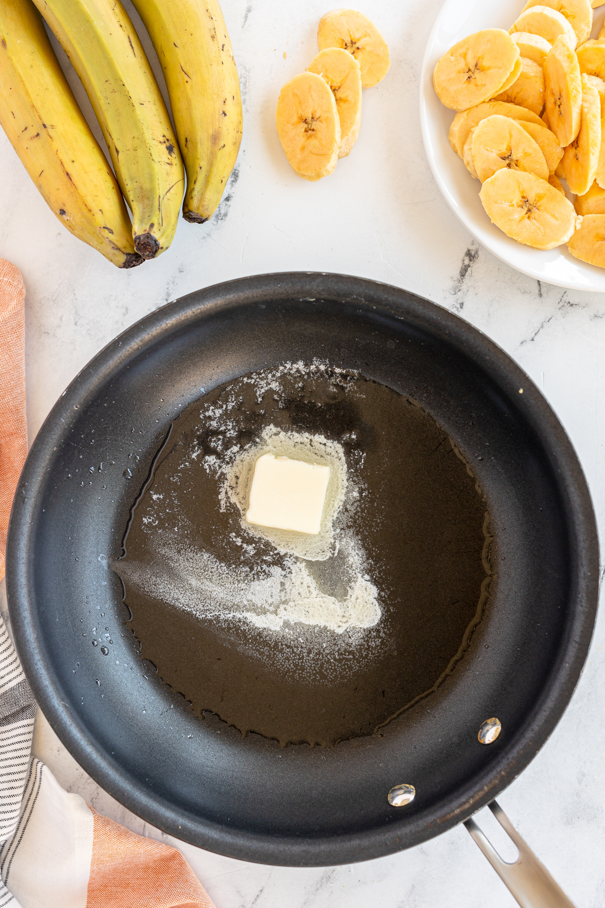 pan with melted butter and coconut oil