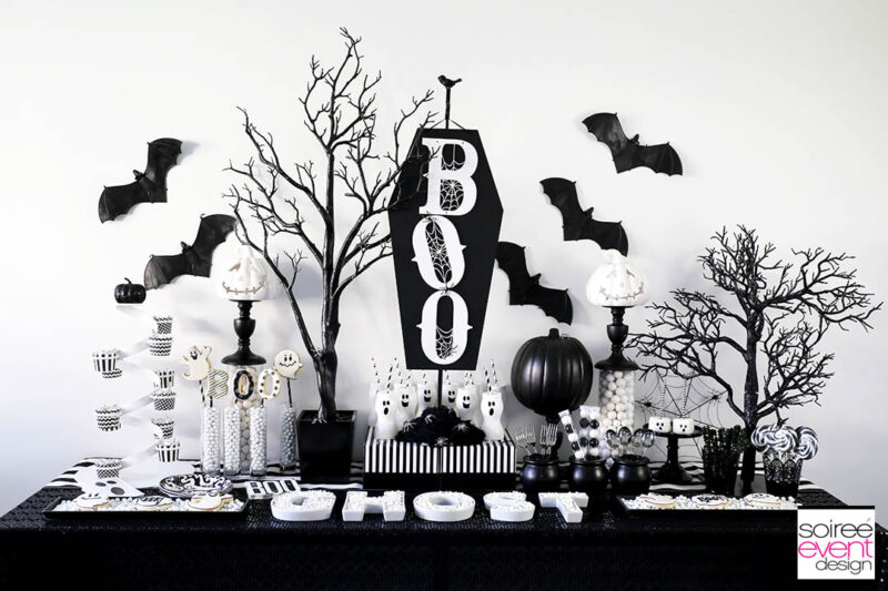 black and white table setting with halloween elements