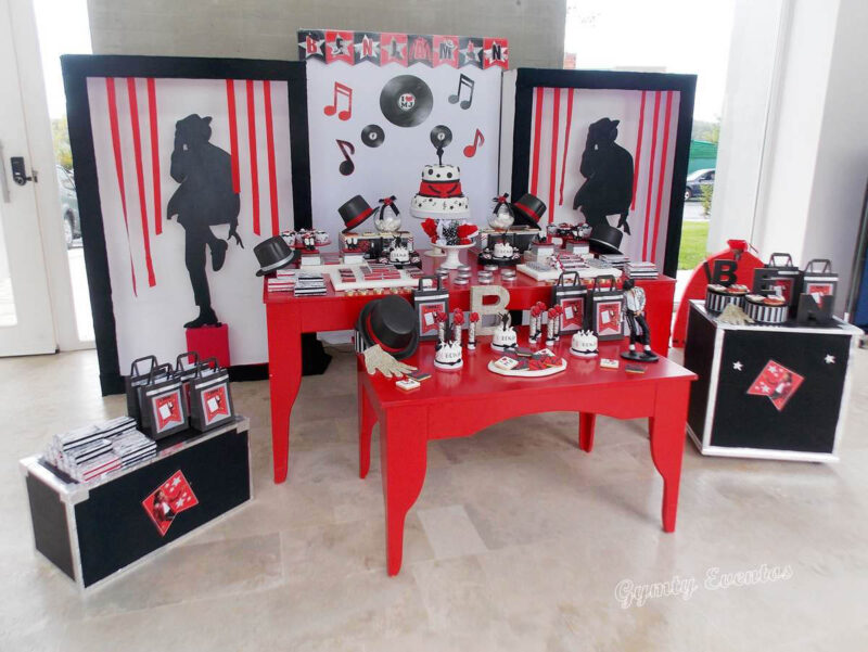 various Michael Jackson themed foods and decor on a table setting