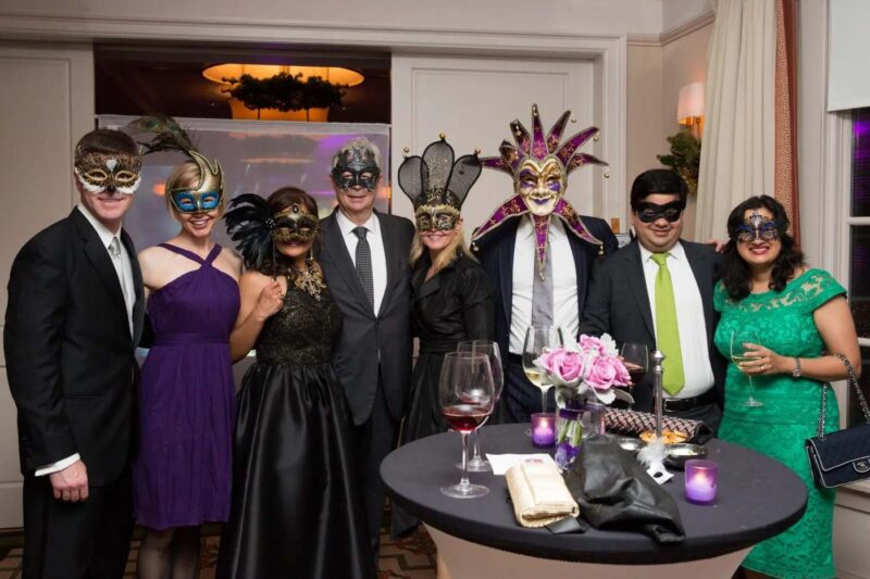 variety of people dressed up and wearing masks