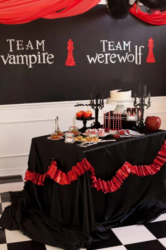 black table setting with apple-themed food