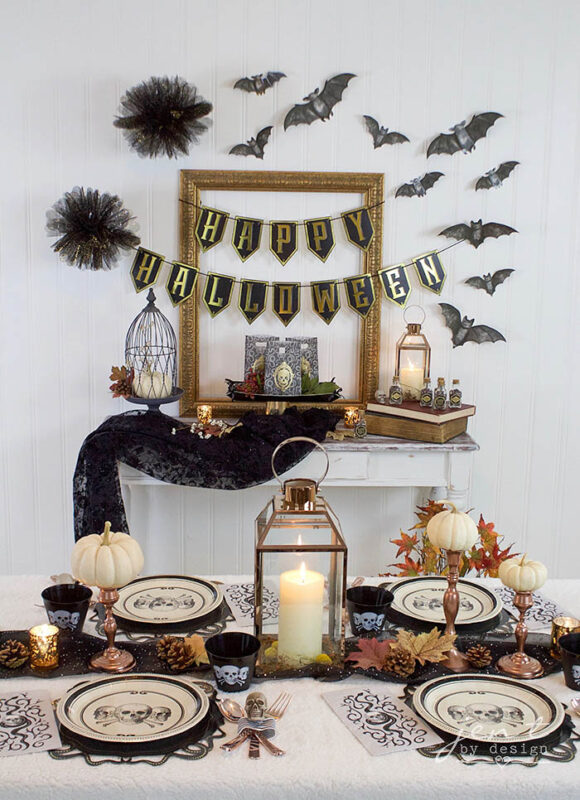 vintage black and gold table setting and bats