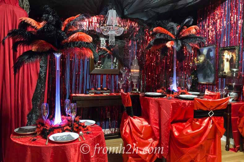 red and black decor with large table centerpieces and streamers