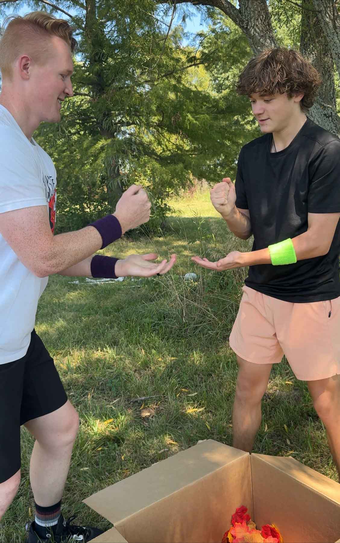 two men playing rock paper scissors