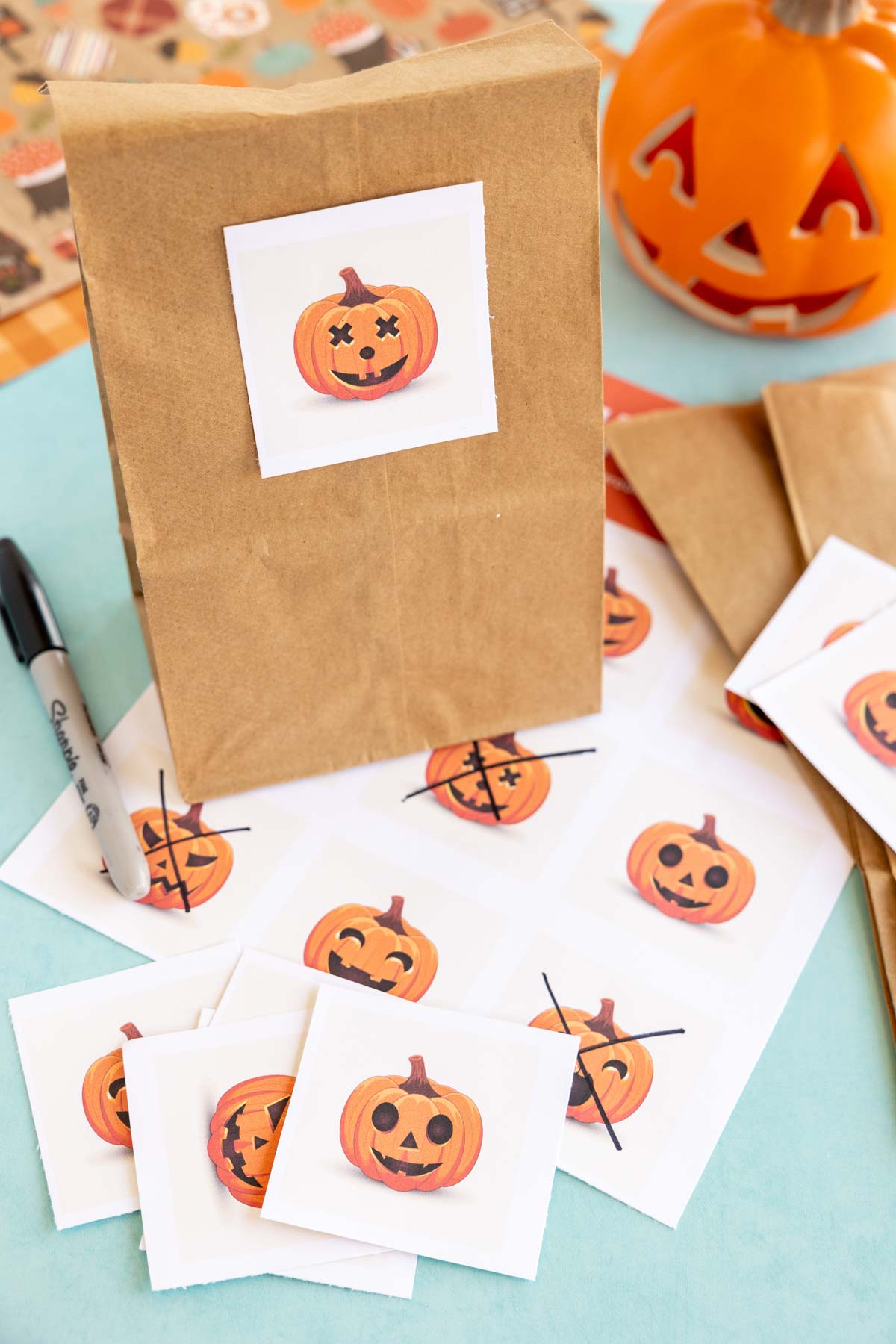 brown bag with a pumpkin sticker on it