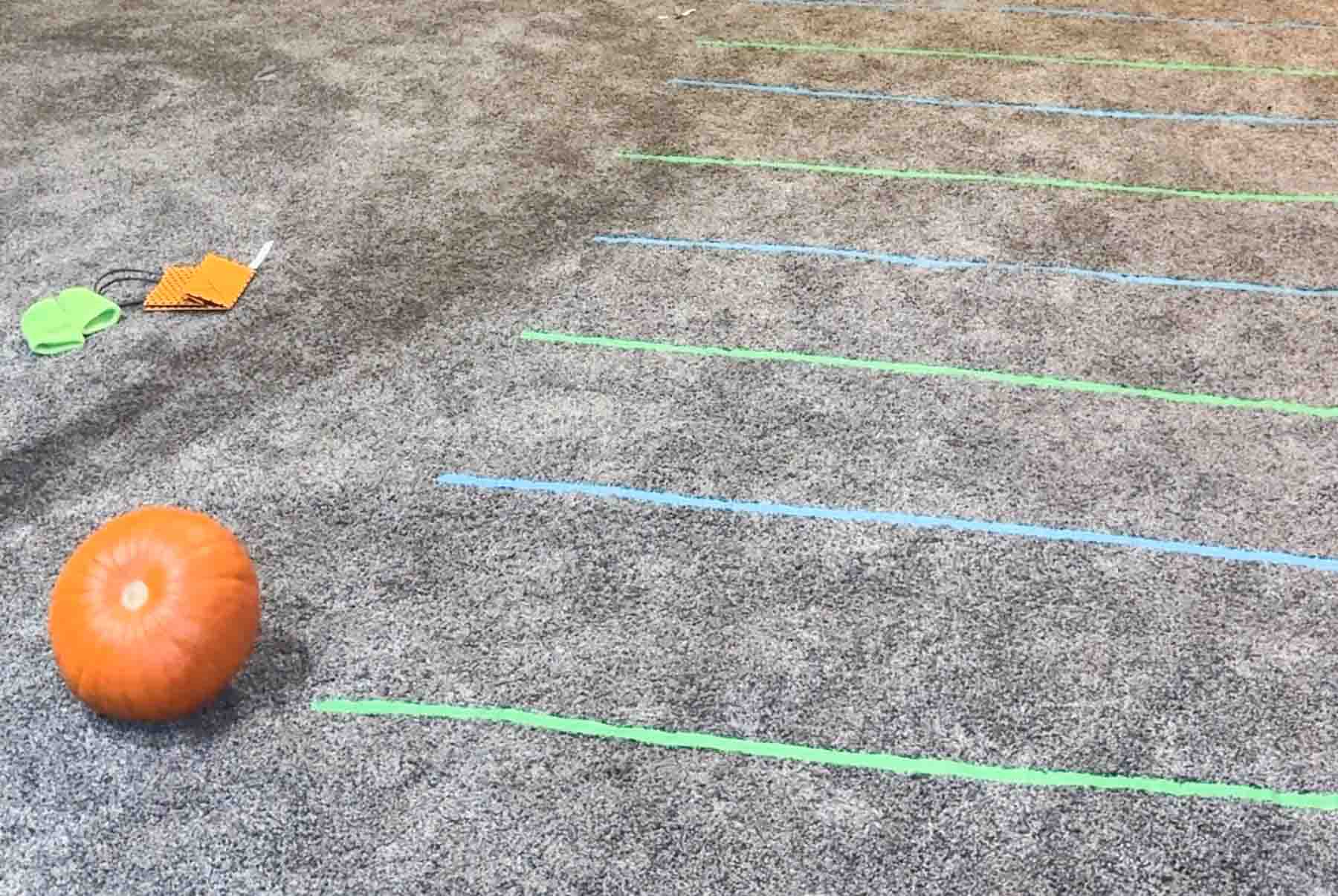 lines of tape and a pumpkin