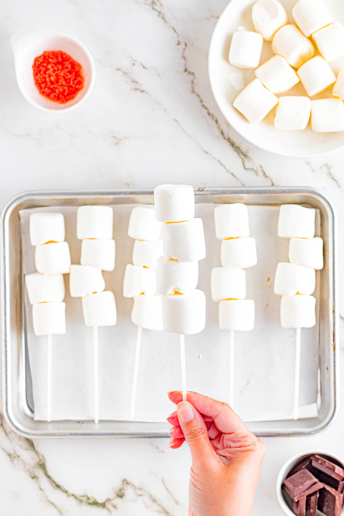 marshmallows on lollipop sticks